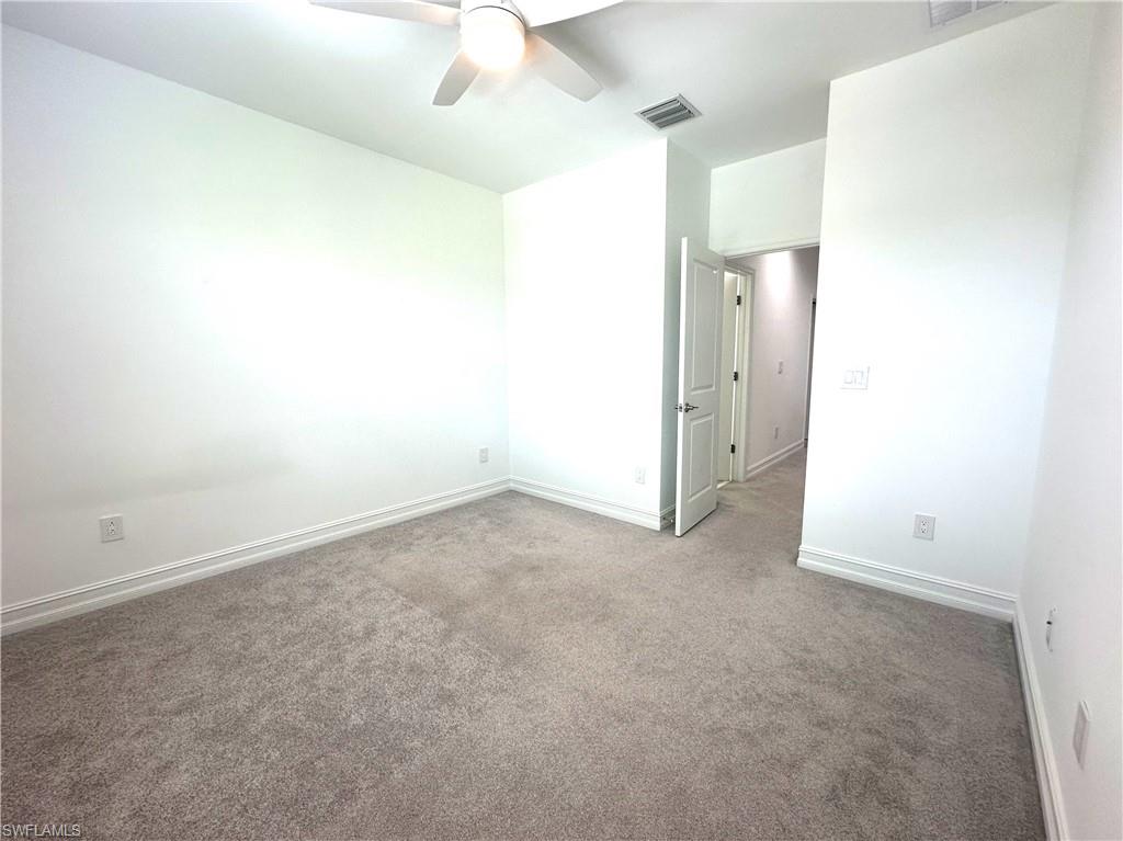 7509 Carnegie Way Naples, FL 34119 - Photo 20 of 33 an empty room with a bathroom