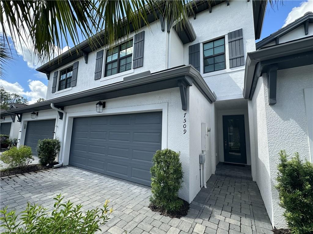 7509 Carnegie Way Naples, FL 34119 - Photo 2 of 33 a house with a outdoor space