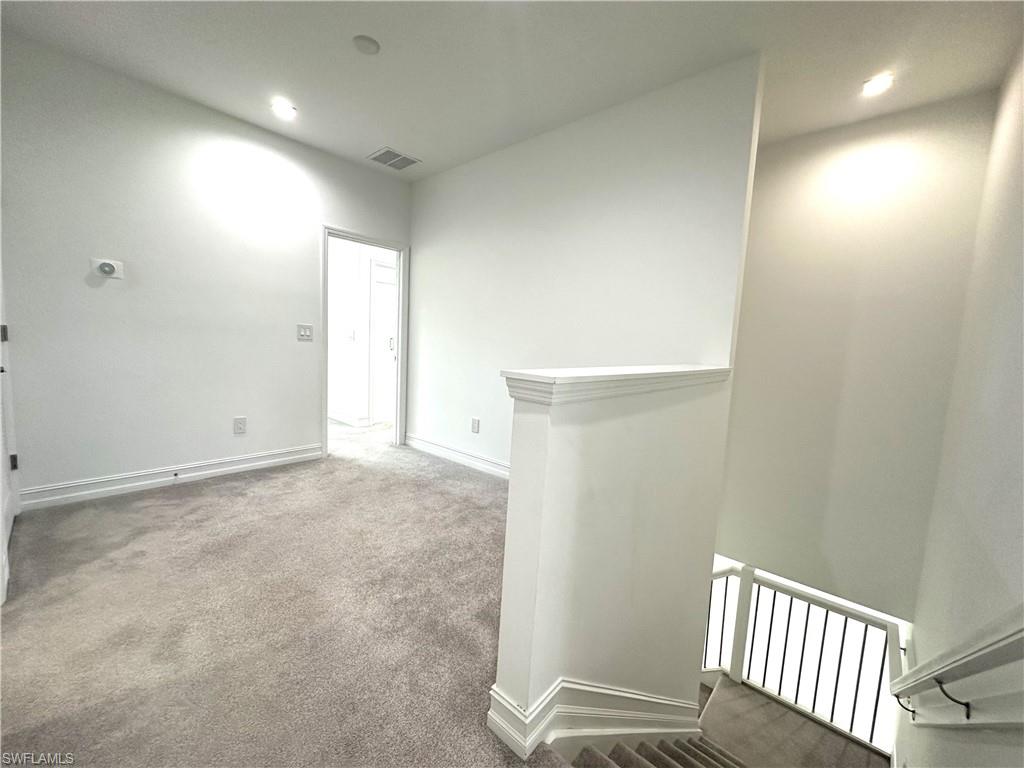 7509 Carnegie Way Naples, FL 34119 - Photo 10 of 33 a view of a hallway