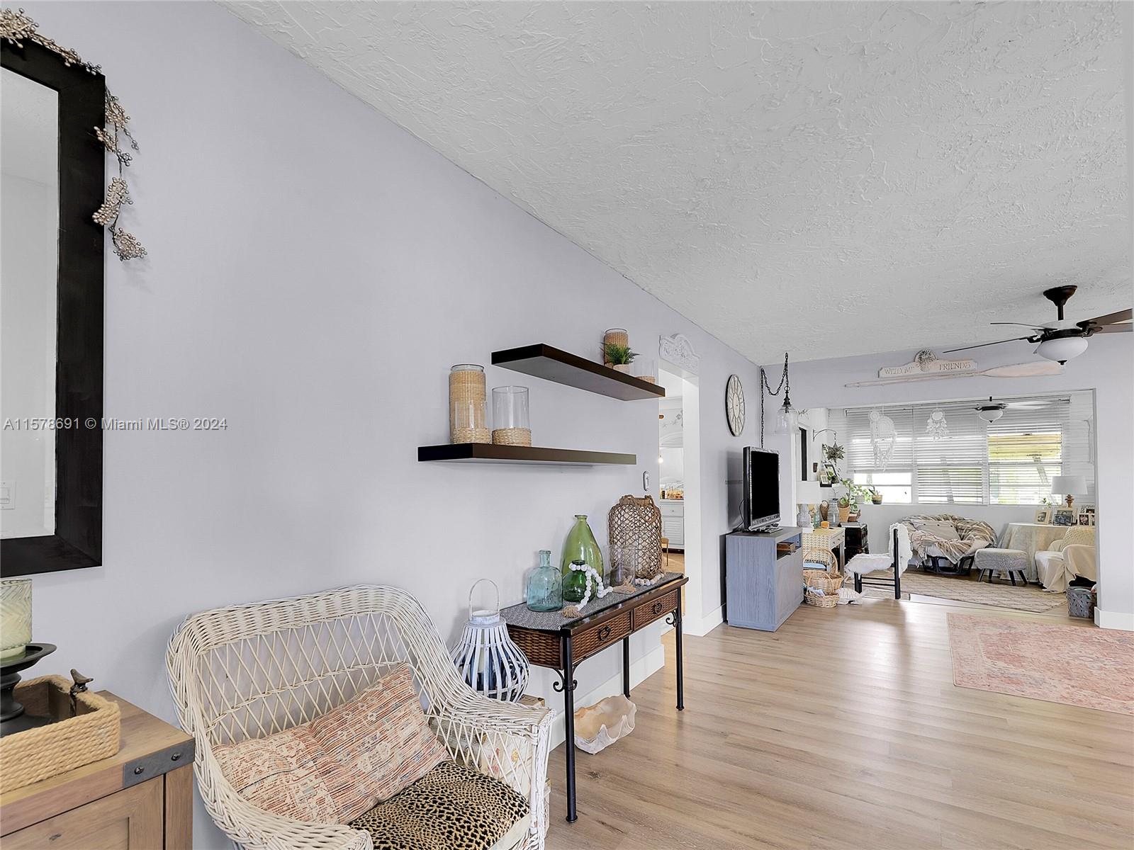 3804 East Shore Road Miramar, FL 33023 - Photo 8 of 61 a living room with furniture and a wooden floor