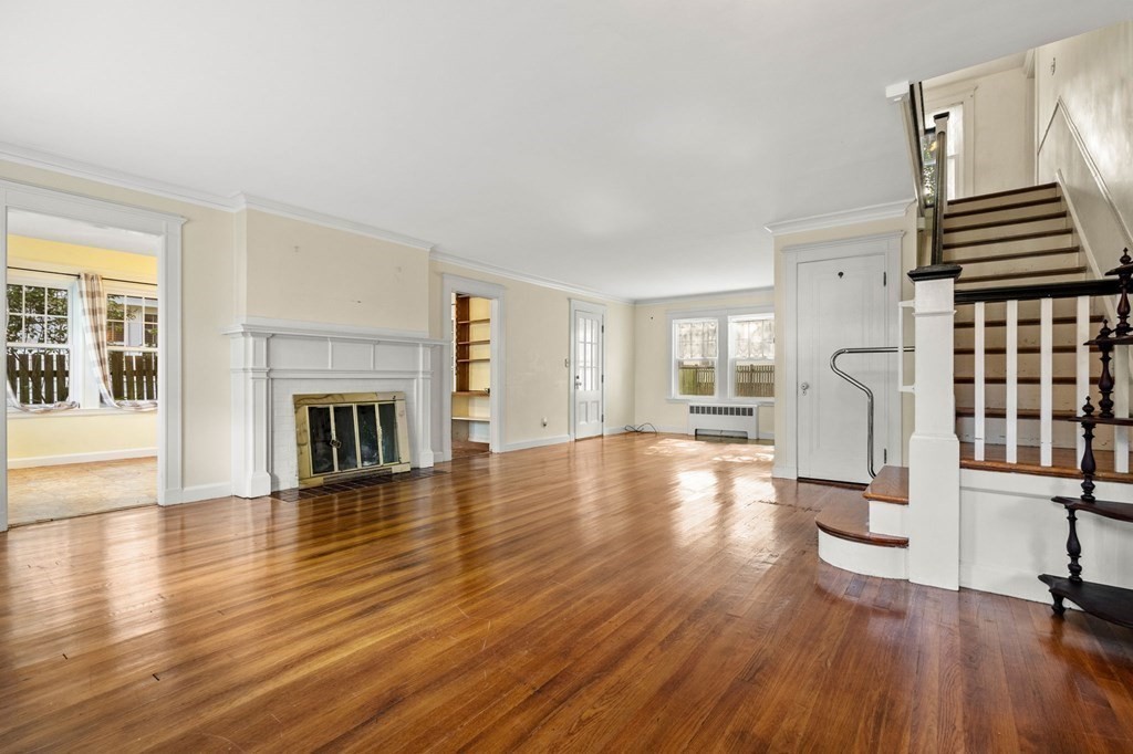 6 Palmer Road Marblehead, MA 01945 - Photo 3 of 23 a view of empty room with wooden floor and fireplace