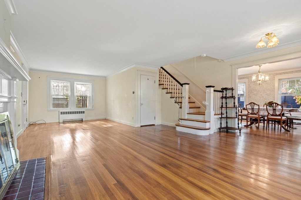 6 Palmer Road Marblehead, MA 01945 - Photo 4 of 23 a view of empty room with wooden floor and window