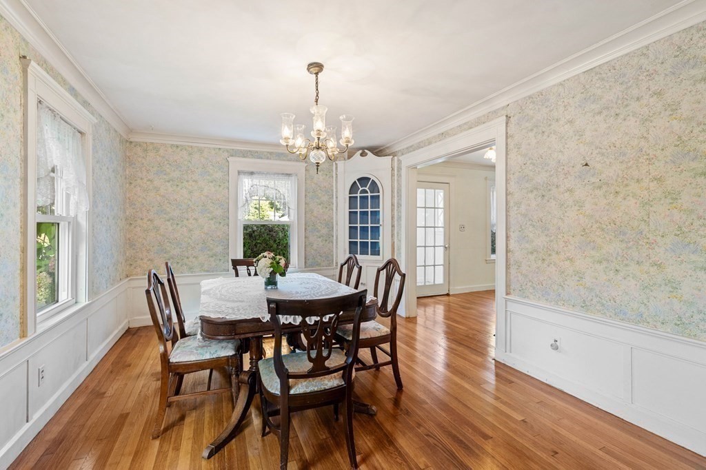 6 Palmer Road Marblehead, MA 01945 - Photo 8 of 23 a view of a dining room with furniture a chandelier and wooden floor
