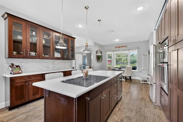 a bathroom with a sink double vanity granite tub shower and a mirror