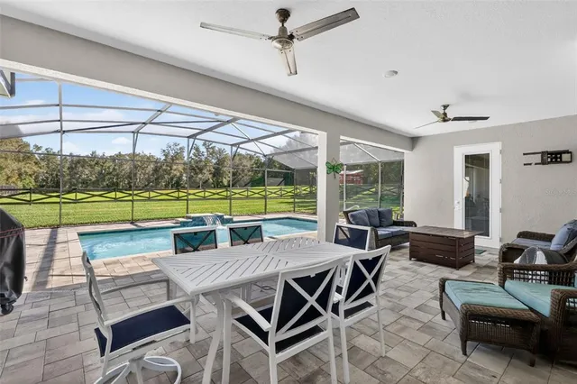 a view of swimming pool with outdoor seating