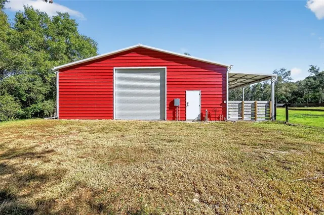 a view of a swimming pool with an outdoor space and seating area