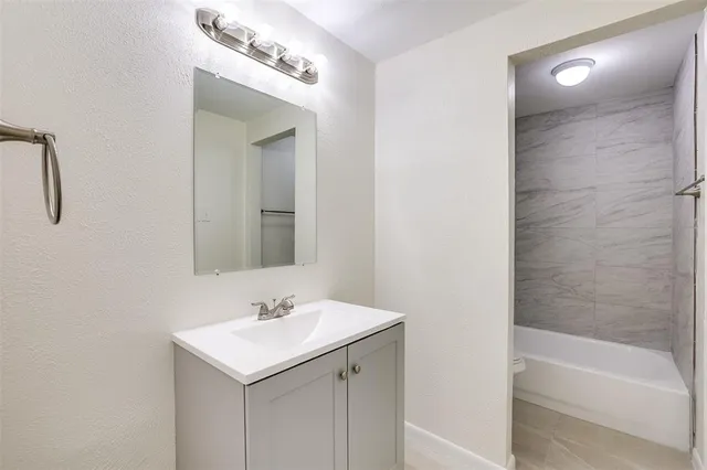 a bathroom with a sink and a bathtub