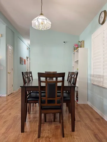 a view of a kitchen with stainless steel appliances granite countertop a refrigerator and a sink