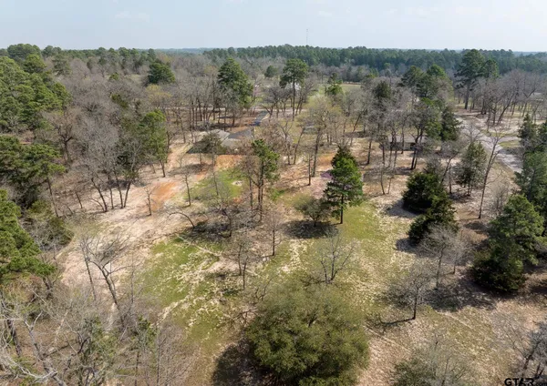a kitchen with a refrigerator a sink and cabinets