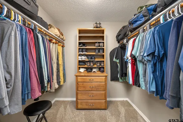 a bathroom with a shower and a sink