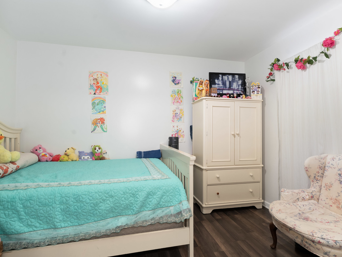 611 Jerome Avenue Joliet, IL 60432 - Photo 13 of 17 a bedroom with a bed and wooden floor