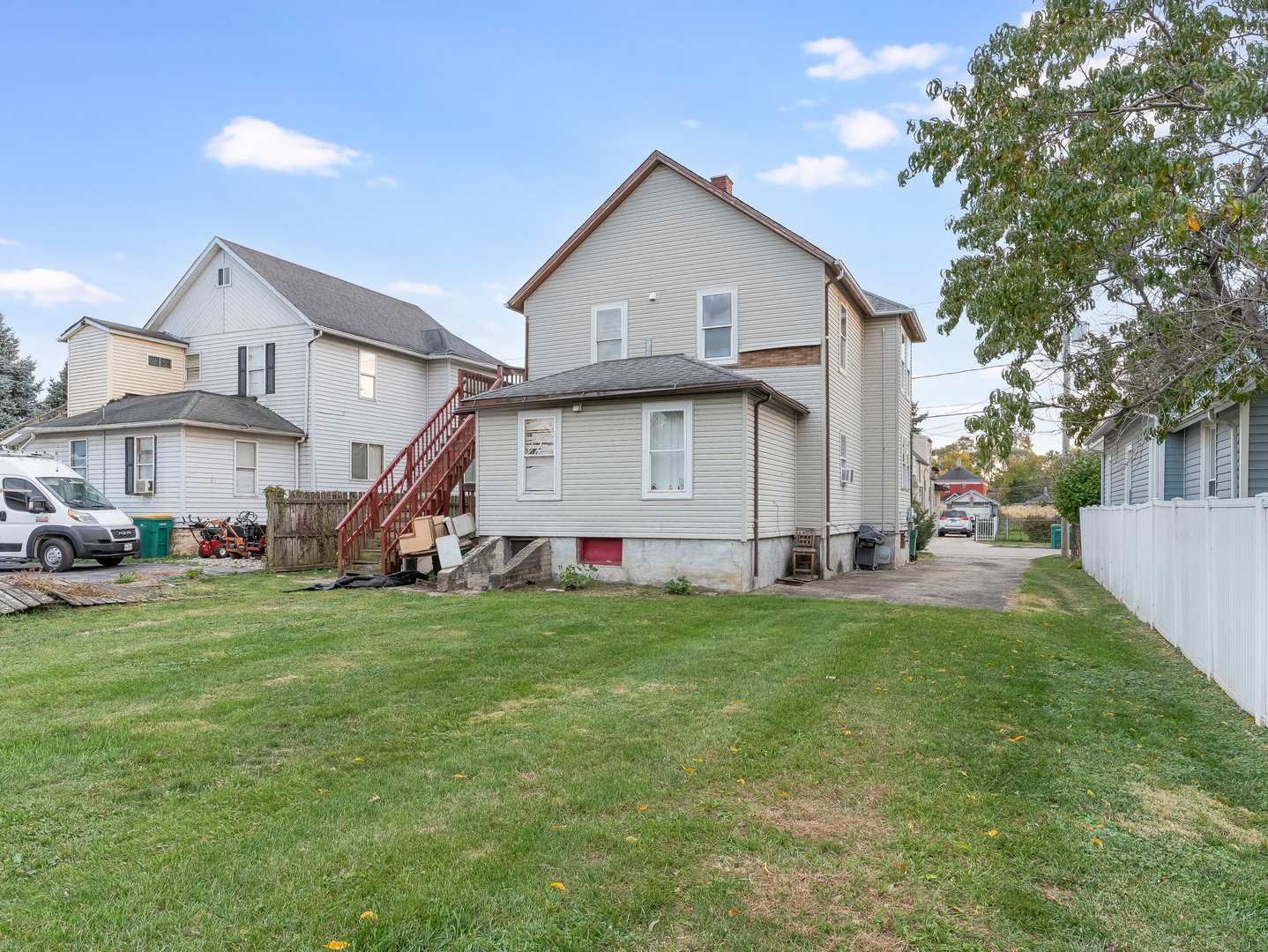 611 Jerome Avenue Joliet, IL 60432 - Photo 15 of 17 a view of a house with a yard and garage