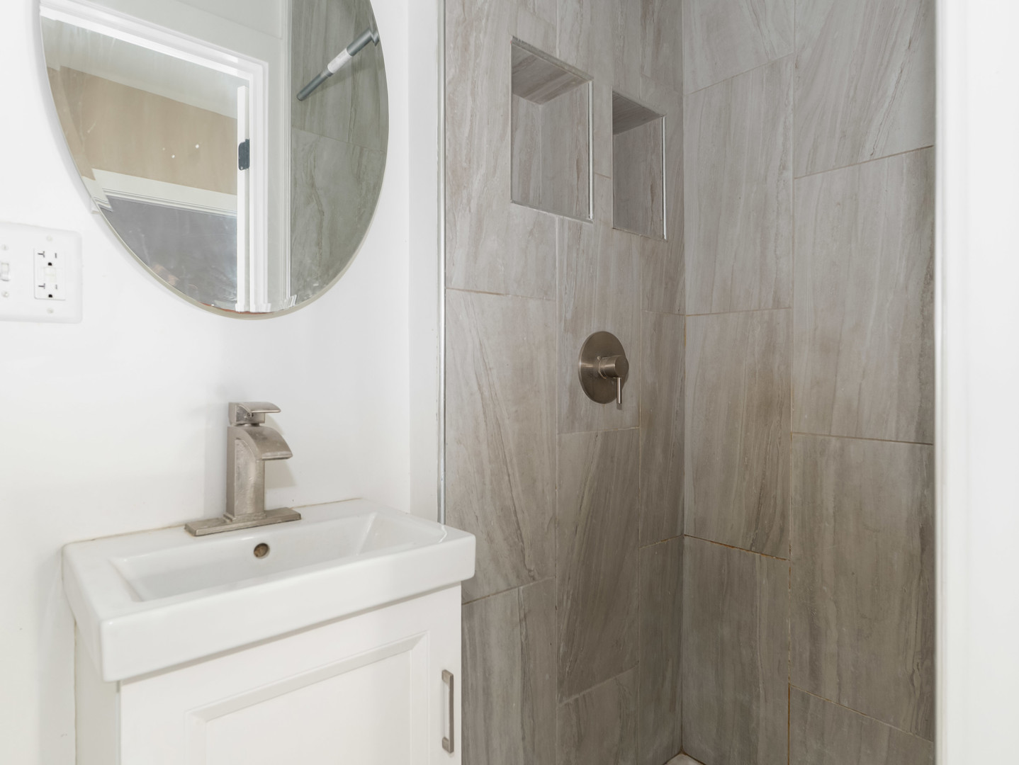 611 Jerome Avenue Joliet, IL 60432 - Photo 7 of 17 a bathroom with a sink a mirror and vanity