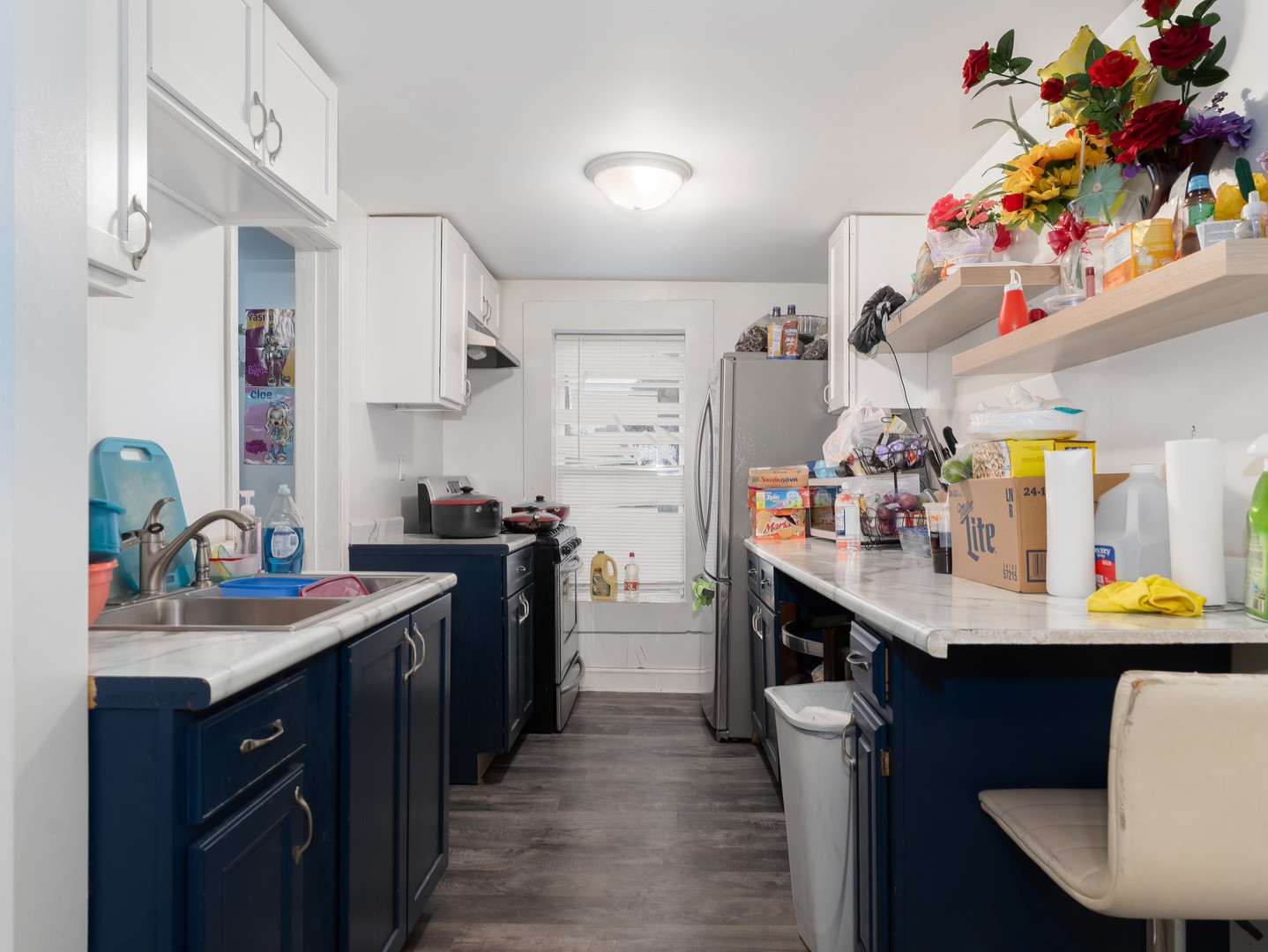 611 Jerome Avenue Joliet, IL 60432 - Photo 9 of 17 a kitchen with a sink stove and cabinets