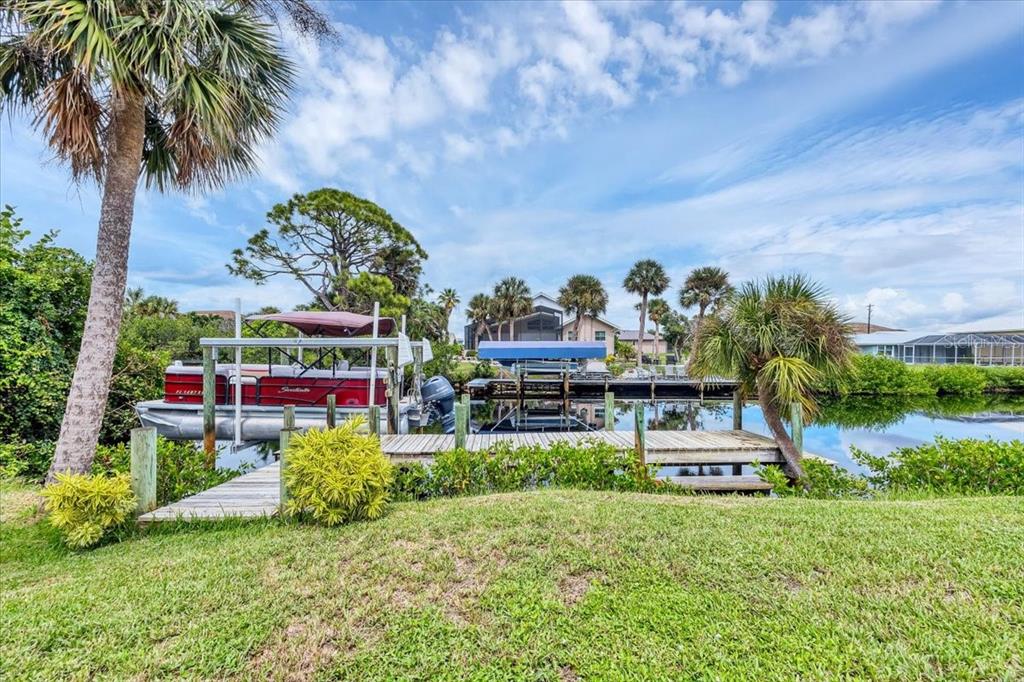 4696 Pompano Street Placida, FL 33946 - Photo 19 of 23 a view of swimming pool with outdoor seating and green space