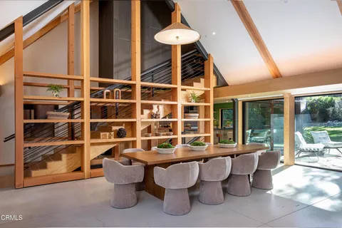 a view of living room with furniture and floor to ceiling window