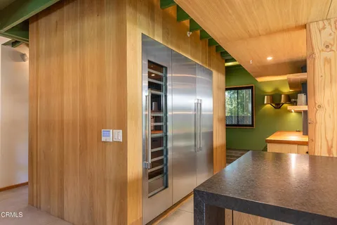 a spacious bathroom with a double vanity sink mirror and shower