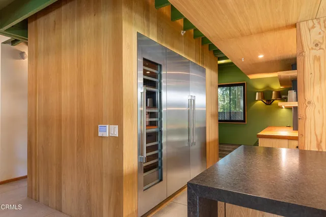 a spacious bathroom with a double vanity sink mirror and shower
