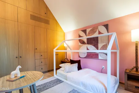 a bathroom with a sink a toilet a mirror and shower