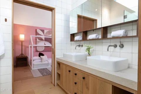 a balcony view with a table and chairs and potted plants