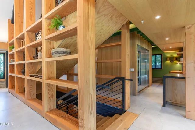 a view of house with swimming pool outdoor seating and plants