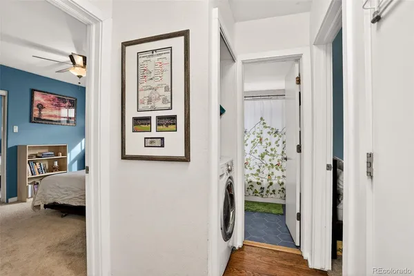 a view of a hallway view with three rooms