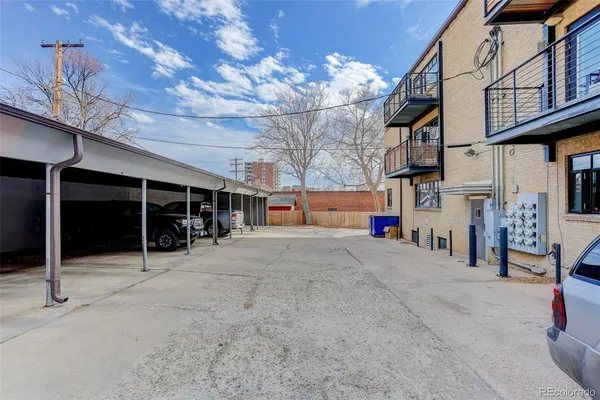 a view of a brick building with many windows