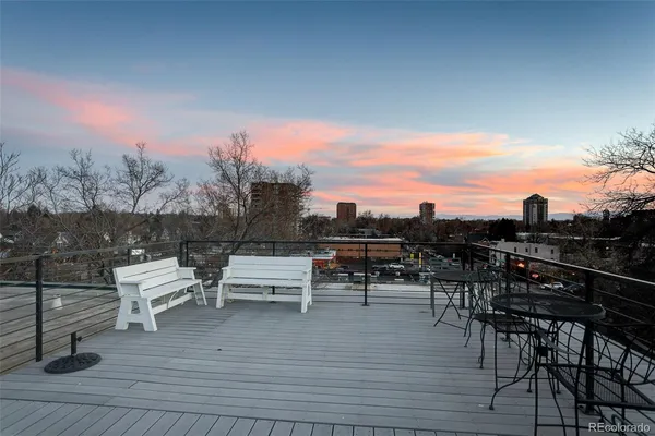 a view of a terrace with wooden floor and bench