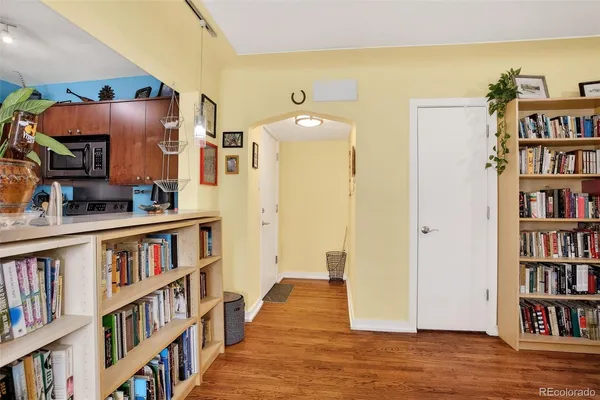 a view of living room with furniture and book shelf