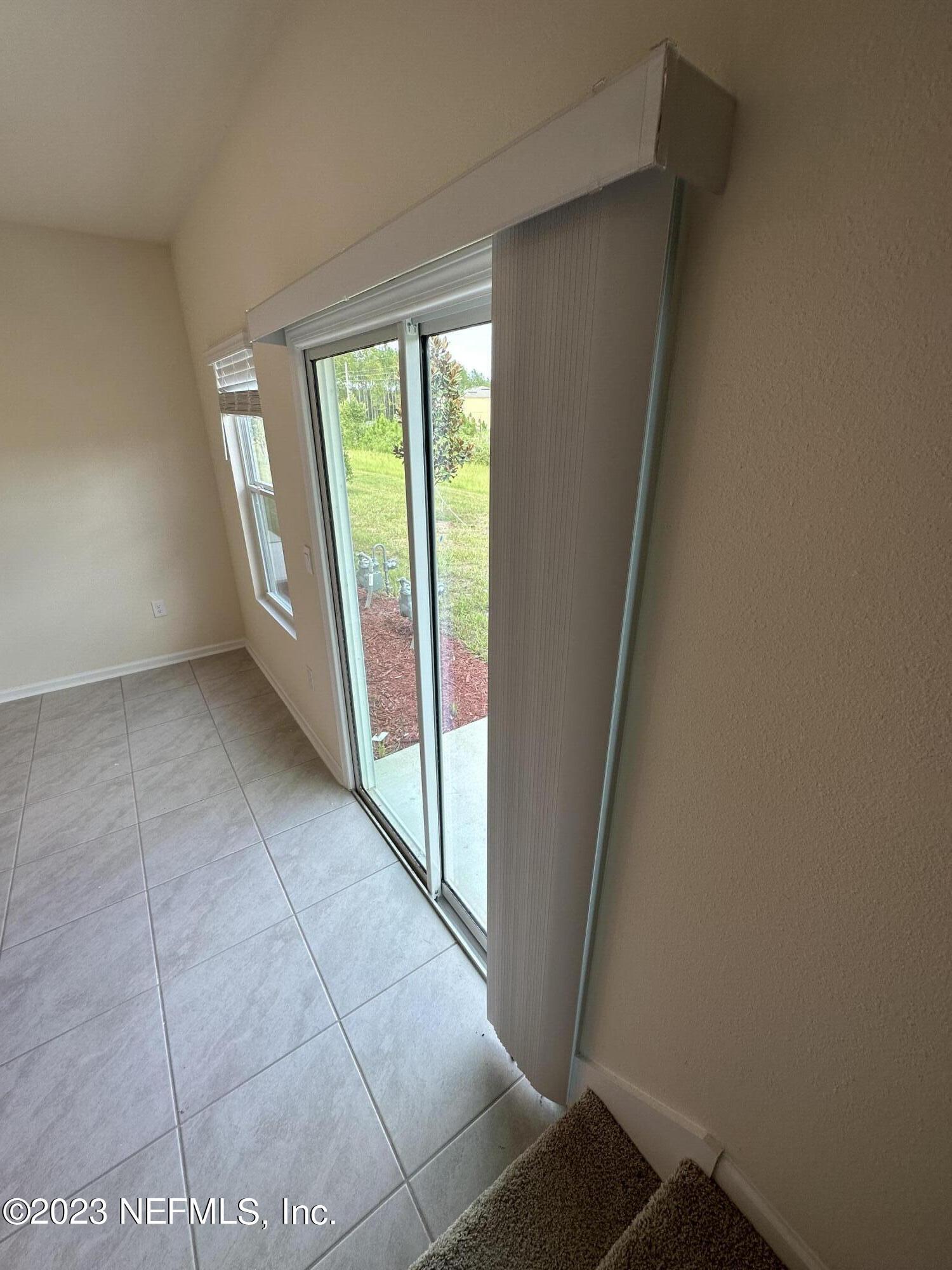 110 Java Lane St. Augustine, FL 32092 - Photo 14 of 23 L WALKING DOWN STAIRS