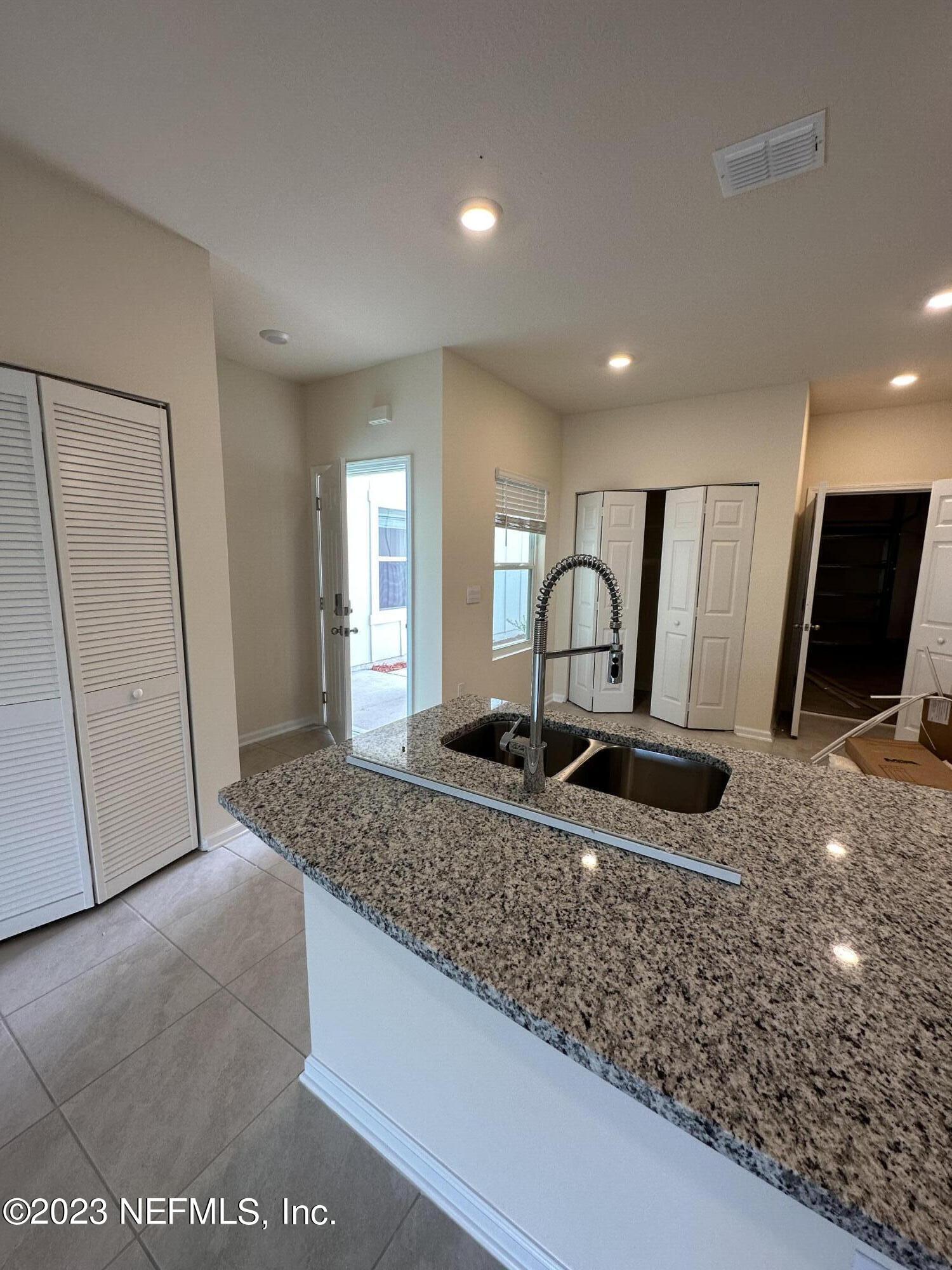 110 Java Lane St. Augustine, FL 32092 - Photo 5 of 23 C FACING THE ENTRANCE FROM THE SOCIAL AR