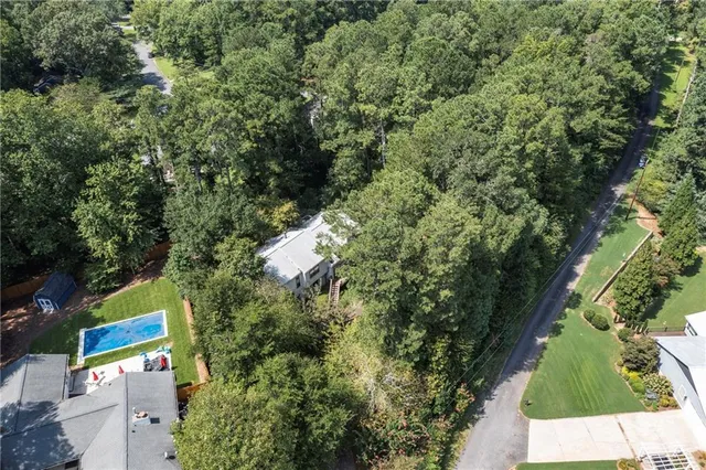 an aerial view of a house with outdoor space and street view