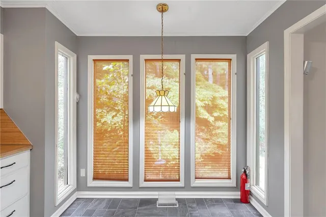 a view of an empty room with a window