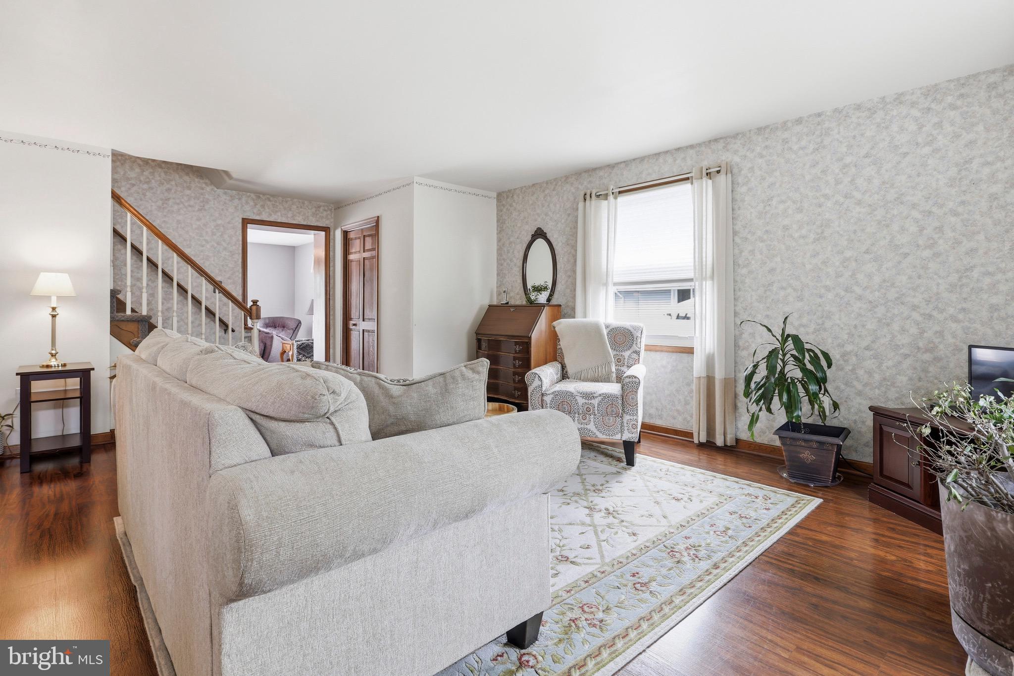 527 Saxer Avenue Springfield, PA 19064 - Photo 6 of 33 a living room with furniture and wooden floor