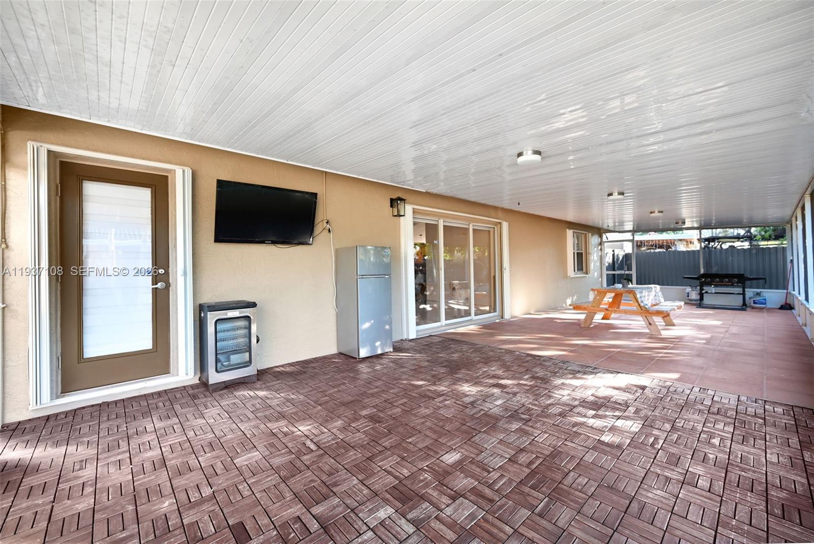 17020 Southwest 149th Avenue Miami, FL 33187 - Photo 11 of 68 a view of livingroom with furniture and a flat screen tv