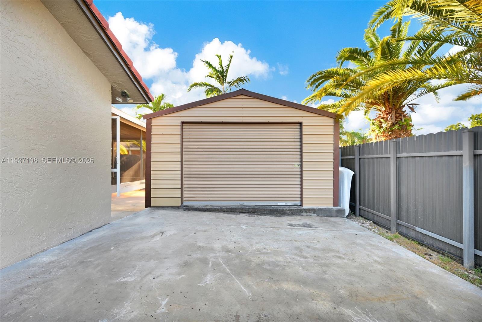17020 Southwest 149th Avenue Miami, FL 33187 - Photo 14 of 68 a view of a house with a yard and garage
