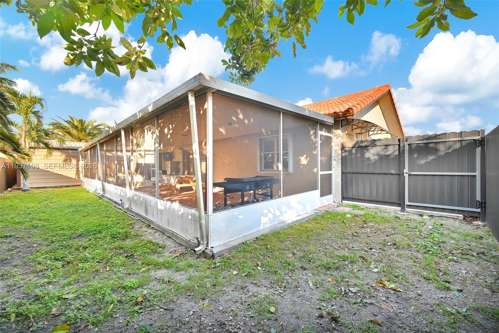 17020 Southwest 149th Avenue Miami, FL 33187 - Photo 18 of 68 a view of a backyard with garden