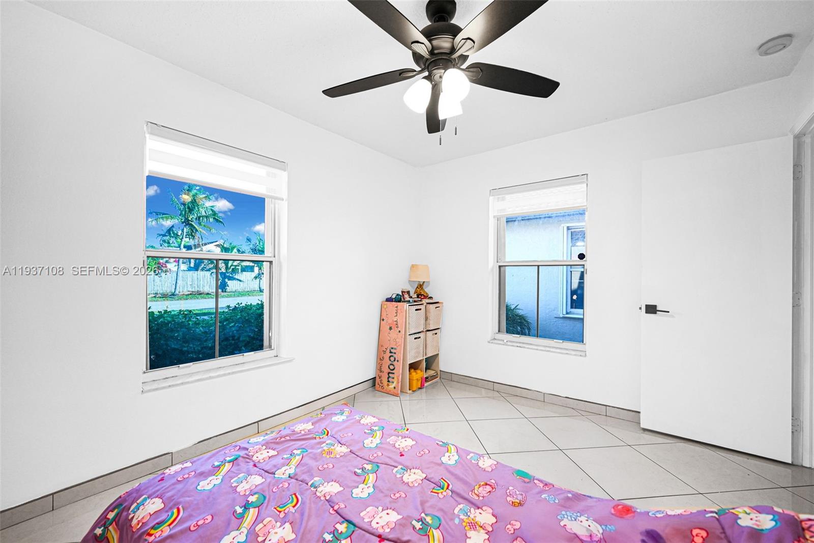 17020 Southwest 149th Avenue Miami, FL 33187 - Photo 22 of 68 a view of an empty room with a window