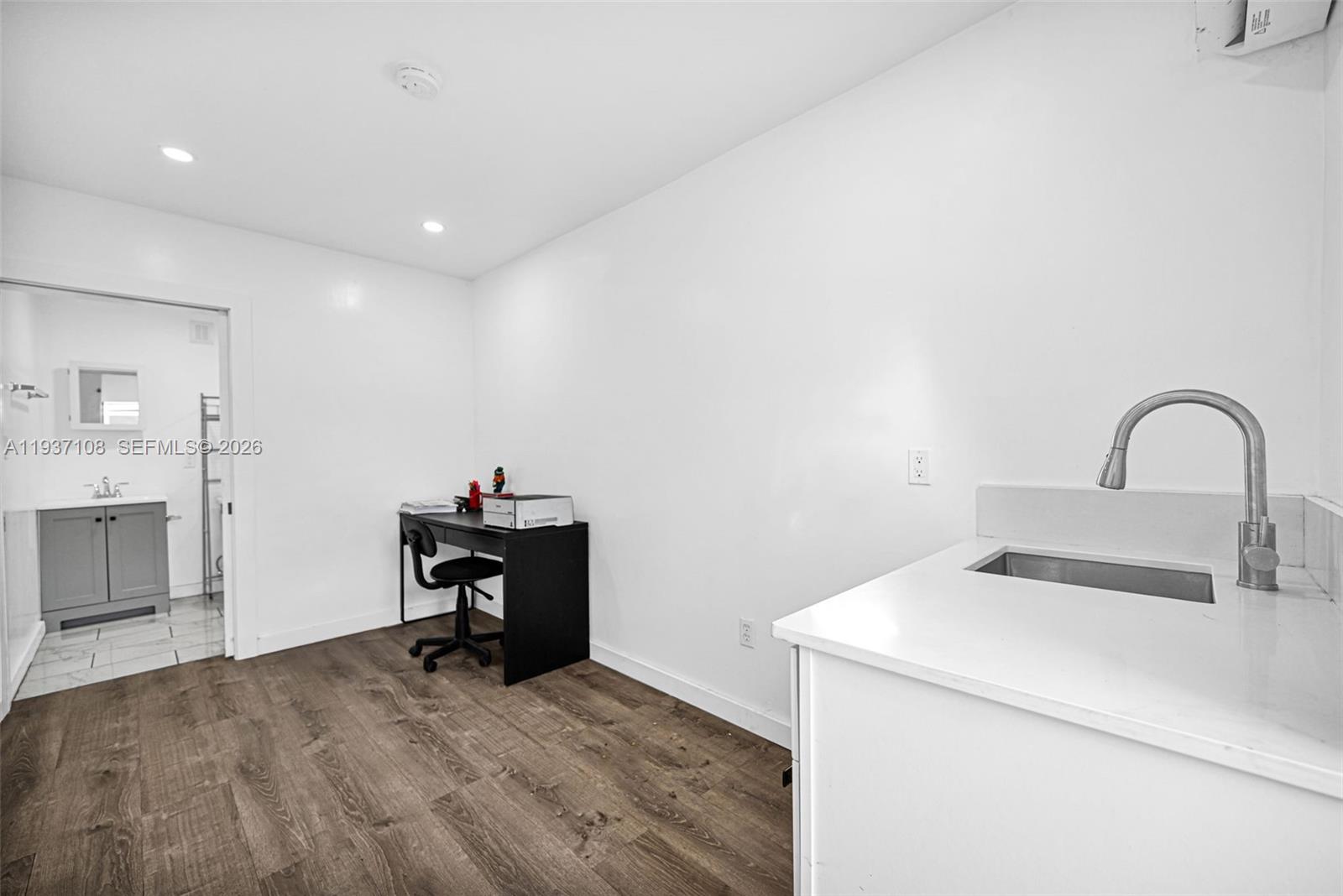 17020 Southwest 149th Avenue Miami, FL 33187 - Photo 24 of 68 a room with a sink and a stove top oven