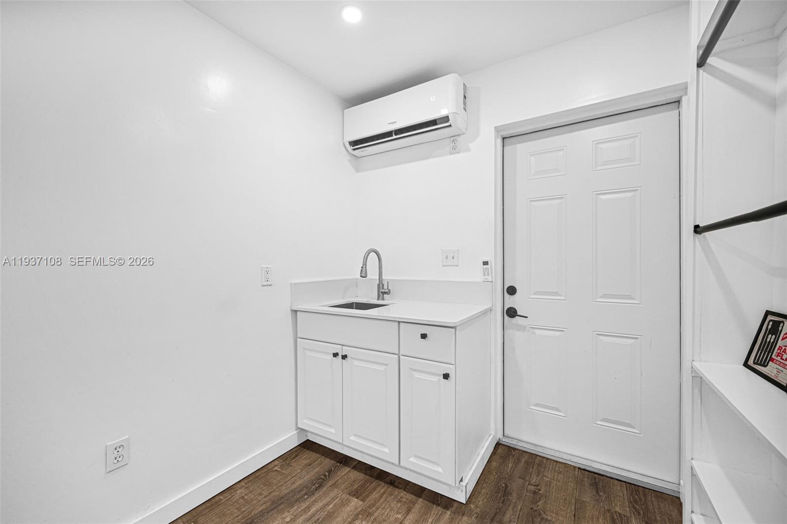 17020 Southwest 149th Avenue Miami, FL 33187 - Photo 29 of 68 a bathroom with a sink a mirror and a shower