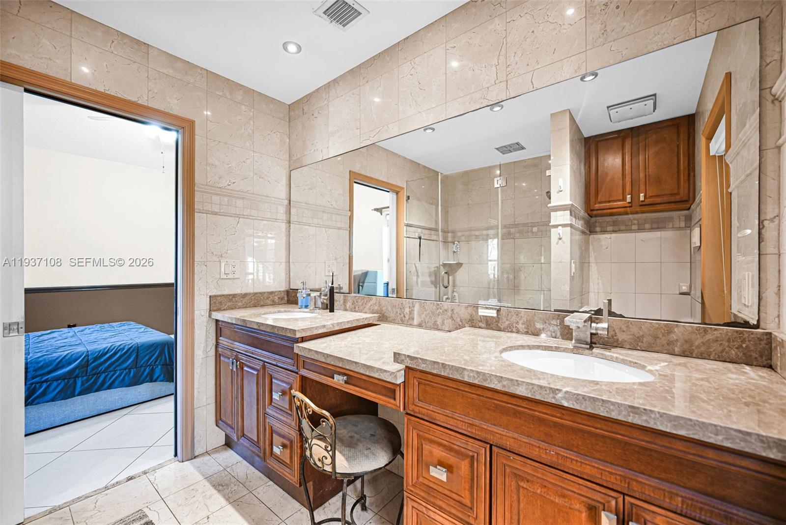 17020 Southwest 149th Avenue Miami, FL 33187 - Photo 38 of 68 a bathroom with a sink double vanity and a mirror