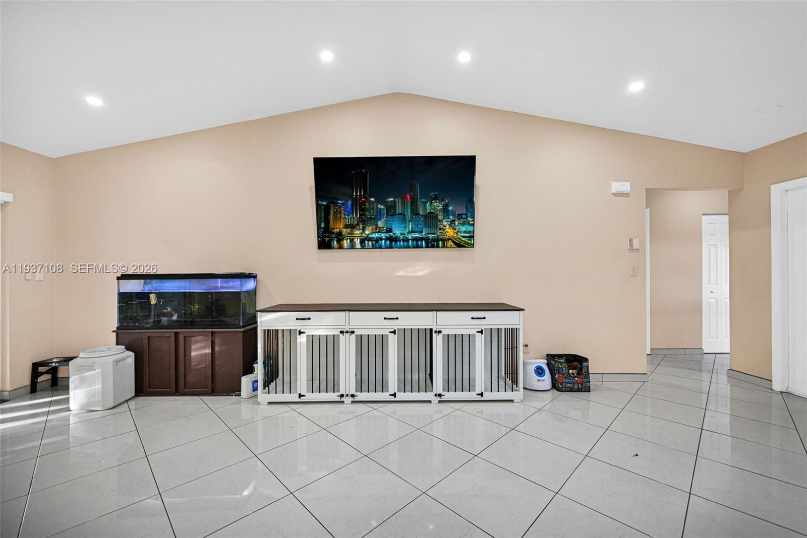 17020 Southwest 149th Avenue Miami, FL 33187 - Photo 47 of 68 a view of an empty room with wooden floor