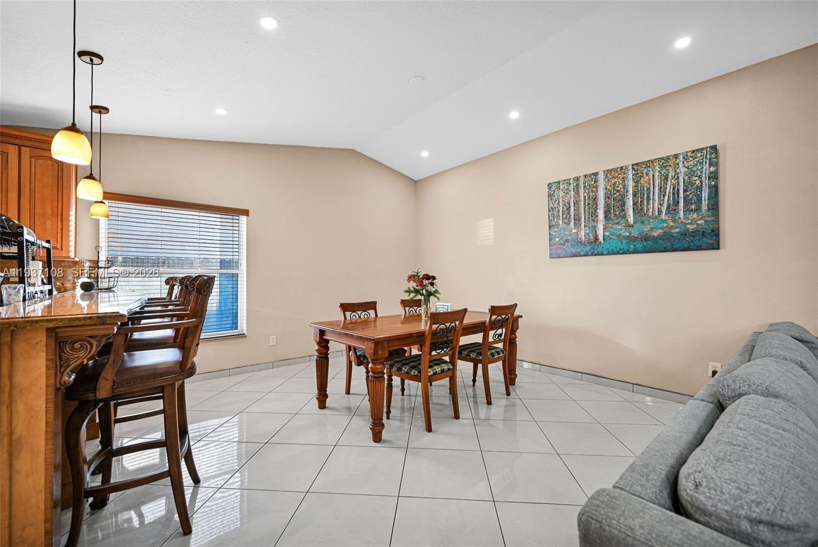 17020 Southwest 149th Avenue Miami, FL 33187 - Photo 49 of 68 a dining room with furniture and window