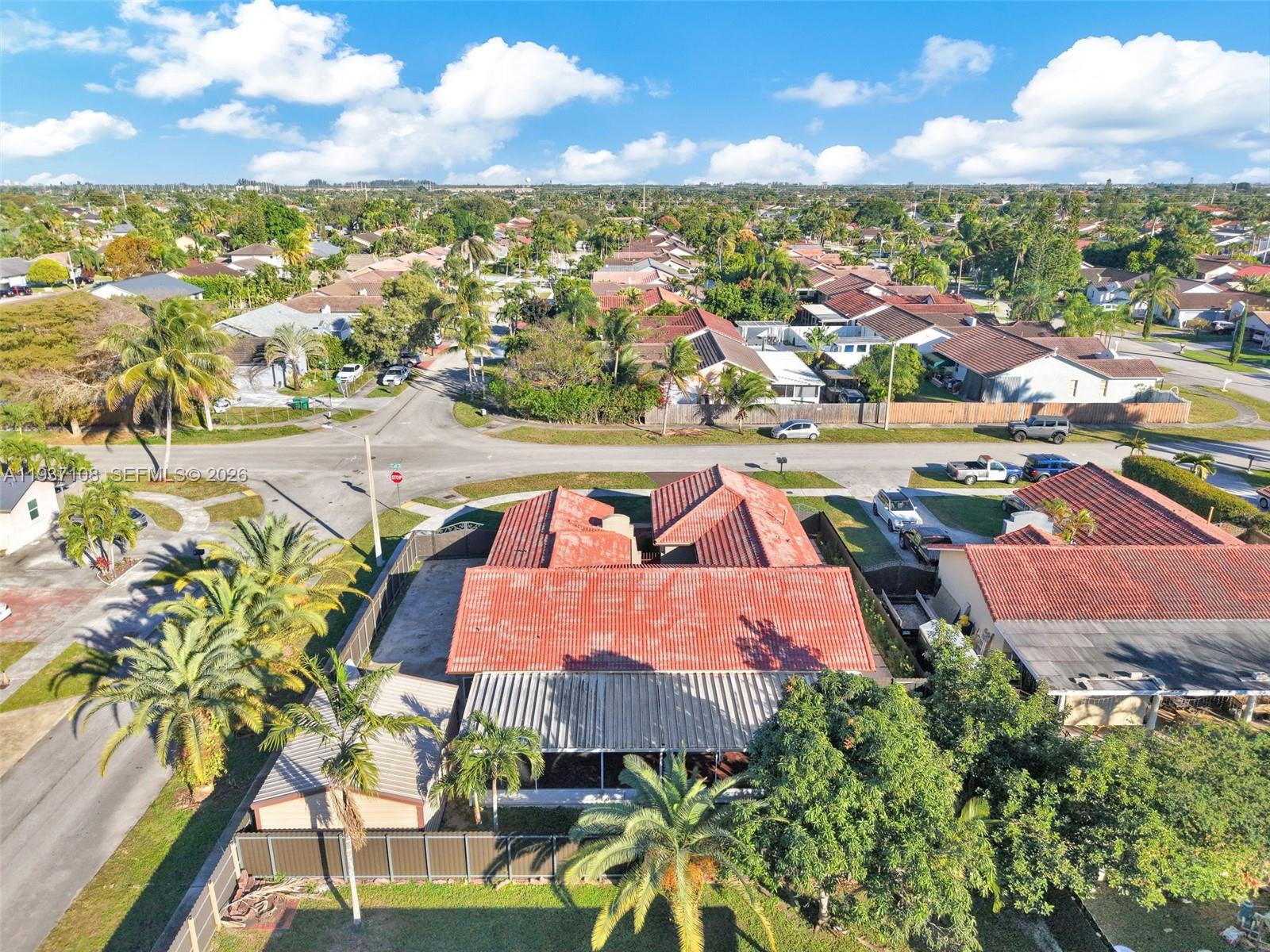 17020 Southwest 149th Avenue Miami, FL 33187 - Photo 5 of 68 an aerial view of residential houses with outdoor space and trees