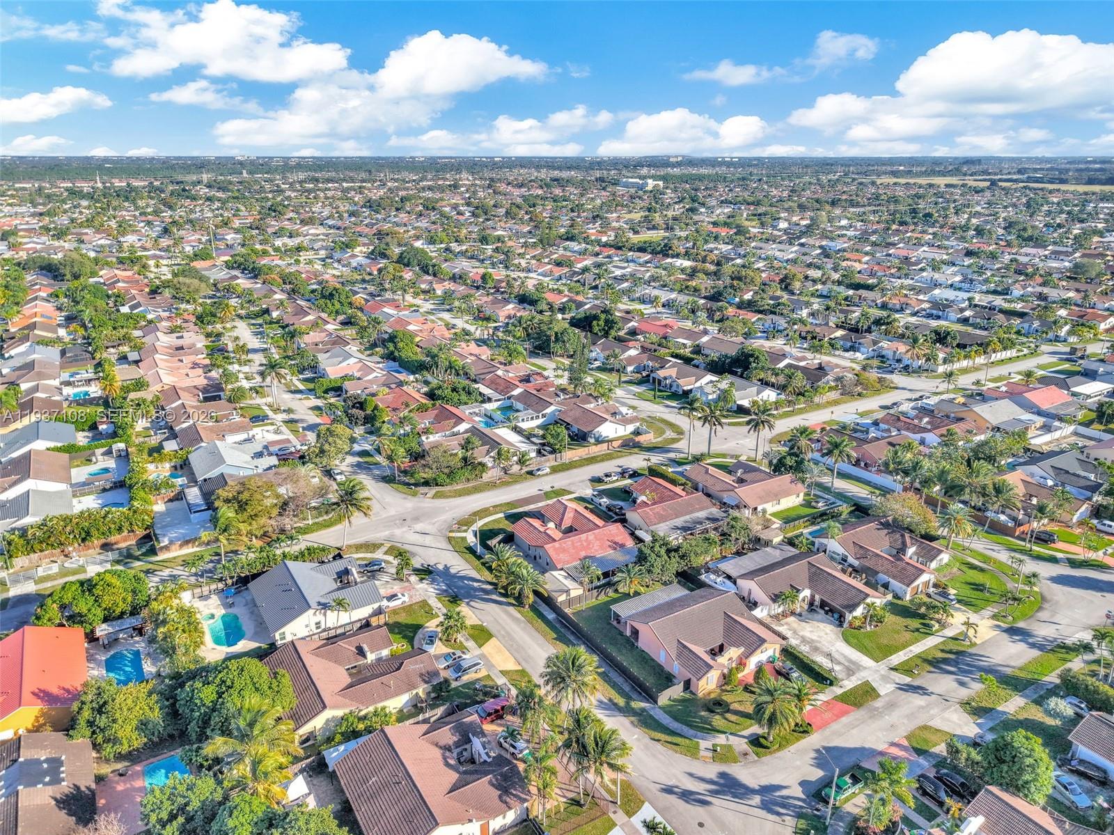 17020 Southwest 149th Avenue Miami, FL 33187 - Photo 67 of 68 an aerial view of residential houses with outdoor space