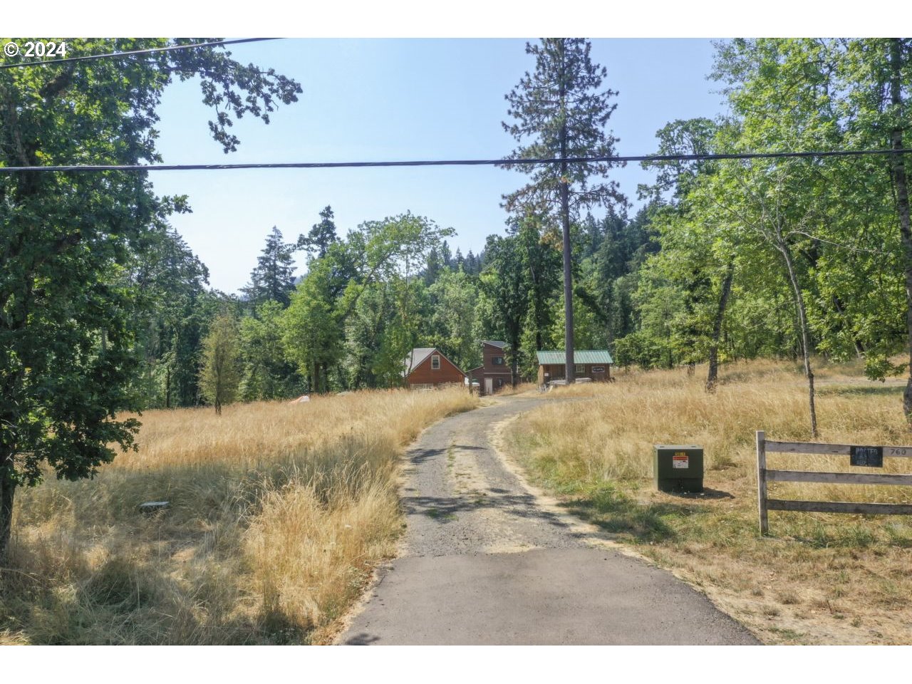 West 40th Avenue, Unit 3 Eugene, OR 97405 - Photo 2 of 8 a view of a dry yard with trees