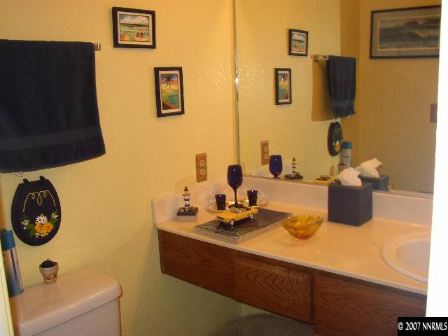 4405 Perro Lane Reno, NV 89502 - Photo 5 of 6 a bathroom with a sink and a mirror