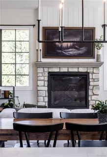 a view of living room with furniture and a chandelier