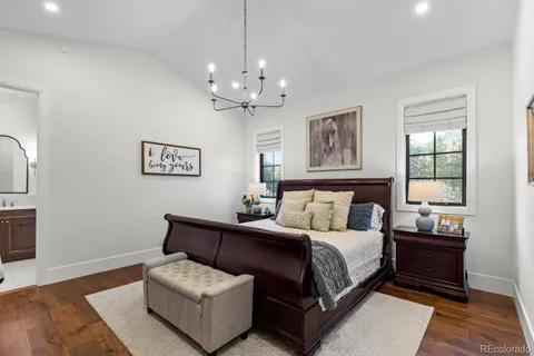a living room with furniture chandelier and a window