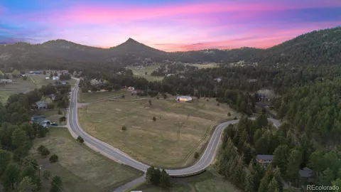 a view of a backyard with a mountain